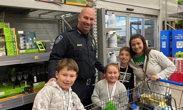 Bullhead City police bring holiday cheer to children with 21st Annual ‘Shop with a Cop’ event
